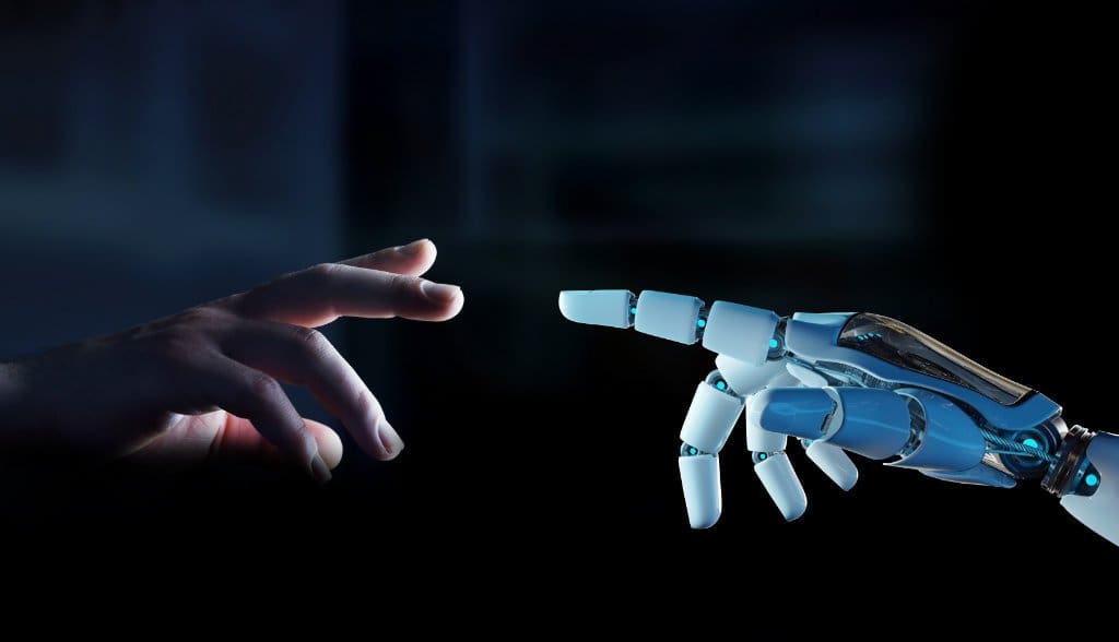 Mão humana e mão robô representando o conceito de inteligência artificial